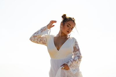 Long sleeve dress lady wearing a white and brown flowers
